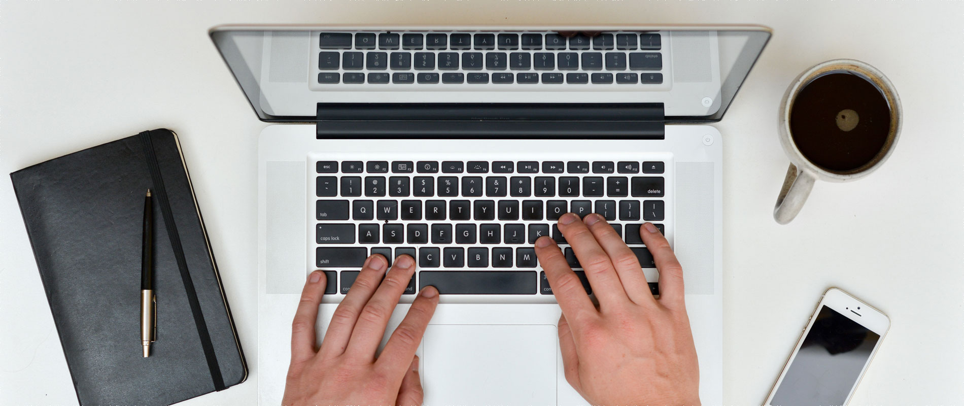 Top view of a laptop through which a user can view email notifications